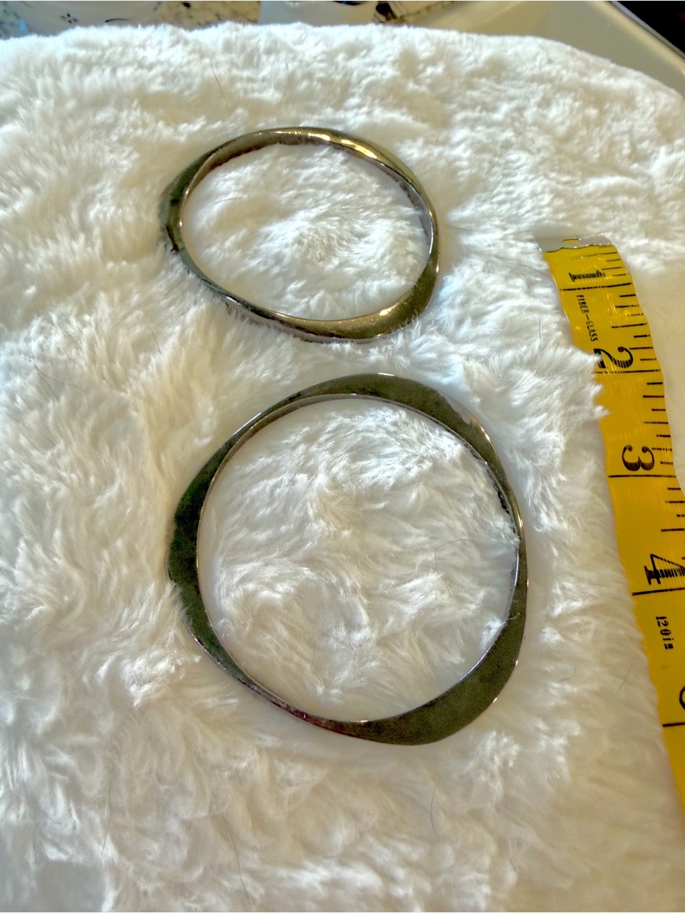 Two dark metal bracelet bangles